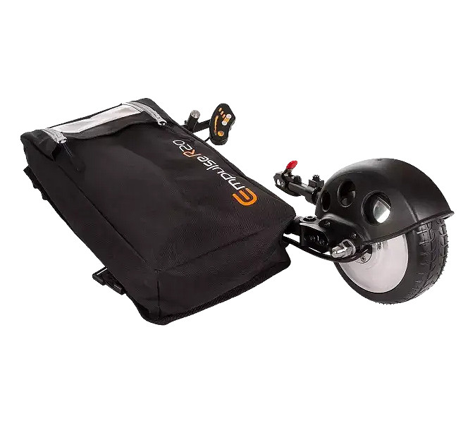 caregiver pushing heavy wheelchair uphill