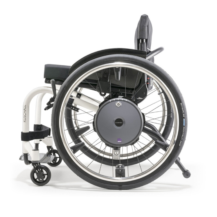 Power assist reducing pushing effort on Quickie Nitrum